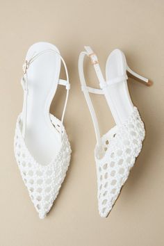 The Billini Davine White Woven Pointed-Toe Slingback Pump will be your go-to for looking effortlessly stylish any day of the week! These faux leather heels feature a woven construction (with trendy pierced details throughout) that shapes a pointed-toe upper with a low-cut collar, supportive side straps, and a slender slingback strap with an adjustable gold buckle. A stunning stiletto heel completes the sleek design! Available in whole sizes only. 2. 75" wrapped stiletto heel. Lightly cushioned i Feminine Closed Toe Slingback Pumps For Summer, Feminine Slingback Pumps With 4-inch Heel For Summer, Feminine Summer Slingback Pumps With 4-inch Heel, Feminine Summer Slingback Pumps With Open Heel, Elegant Synthetic Slingback Pumps For Spring, Summer Wedding Slingback Pumps With Wrapped Heel, Feminine Summer Slingback Pumps With Heel Strap, Spring Wedding Slingback Pumps With Wrapped Heel, Feminine Summer Slingback Kitten Heels