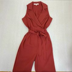 Beautiful Brick Red Sleeveless Jumpsuit With Zip Closure, Snaps And Tie Belt At Waist. Size Small. Length 58” From Shoulder To Hem Brand New Without Tags. Casual Red Jumpsuits And Rompers For Work, Sleeveless Fitted Jumpsuits And Rompers For Work, Fitted Sleeveless Jumpsuits And Rompers For Work, Fitted Sleeveless Jumpsuits For Workwear, Red Overall Jumpsuit For Work, Red Jumpsuits And Rompers For Summer Workwear, Women's Rowing, Sleeveless Jumpsuits, Brick Red