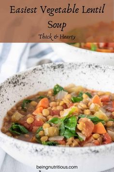 a white bowl filled with vegetable lentil soup