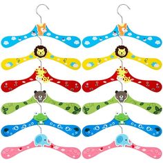 several colorful animal shaped hair clips hanging from hooks on clothes pins in different colors and designs