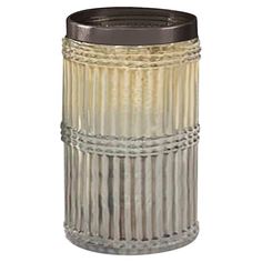 a glass trash can with metal lid and silver trimmings on the bottom, in front of a white background