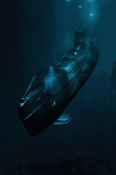 a submarine floating in the ocean at night