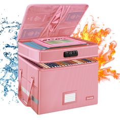 a pink cooler with cd's in it sitting on fire and water