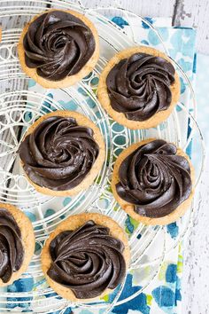 chocolate frosted cookies on a wire rack