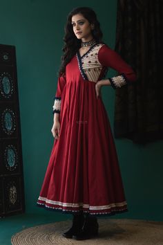 A maroon voil kalidaar dress, with metal coin and kantha work on the yoke, with fringe lace on the sleeves and border. The beautiful dress comes with full flare kalli based on voil makes it very soft to fall. Kanjivaram Sarees Silk, Outfits Indian, Stylish Tops For Women, Velvet Dress Designs, Anarkali Dress Pattern, Latest Dress Design, Sarees Silk, Kurti Designs Latest