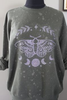 Was $45, now $20. Super soft pullover with large, glitter graphic.  Sweatshirt is Wild Fable brand from Target. Hunter green with light tie-dye spots. Crewneck, long sleeved. Graphic is multi-colored glitter. Large moth with moon phase. Large Moth, Boho Sweatshirt, Dye Sweatshirt, Tie Dye Sweatshirt, Tie And Dye, Wild Fable, Moon Phases, Hunter Green, Batik