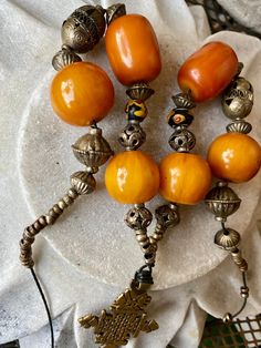 Bold Copal Amber Resien Ethiopian Cross Vintage Necklace necklace measures aprox 28 inches around