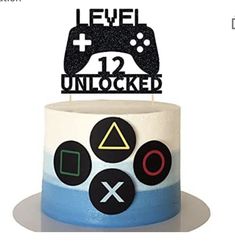 a cake with a video game controller on top and the words level 12 unlocked above it