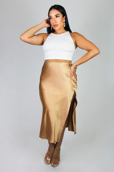 Elevate your style with our knee-length side slit satin skirt. Made from luxurious satin fabric, it offers a smooth, lustrous texture. It features a side zipper closure, and a side slit. This skirt combines elegance to any look, whether you're going for an elevated casual look or dressing for a special occasion. Embrace its timeless appeal and exude confidence with every step you take. During warmer months, style this midi skirt with heels or sandals. Transition into cooler month effortlessly wi Elevated Casual, Knee High Heels, Exude Confidence, High Heel Boots Knee, Satin Midi Skirt, Every Step You Take, Satin Skirt, High Heel Boots, Satin Fabric