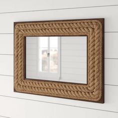 a mirror mounted to the side of a wall