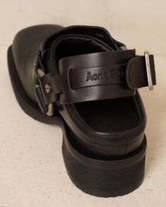 Leather buckle mules by Acne Studios. Slingback mules crafted in sublime calf leather with distinctive square toe silhouette. Adorned with tarnished metal hardware, including biker-inspired ring, buckle and studs, these mules make a provocative footwear statement to add a daring edge to any ensemble. Calf Leather Upper, Calf Leather Lining, Rubber Sole.Made in Italy. Marni Calf Hair Mules, Shoes That Go With Everything, Slingback Mules, Black Mules, Mule Shoes, Funky Shoes, Shoe Inspo, Fashion Inspiration Design, Leather Buckle