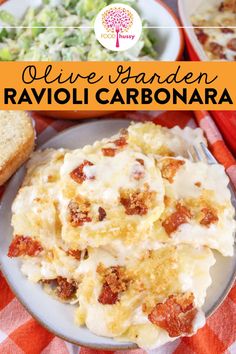 a plate of ravioli carbonara on a table with bread and salad in the background