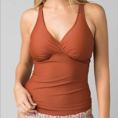 Prana Women’s Kayana D- Cup Tankini Swim Top Nwt Size Xs 32 D Cup Color Is Called Deep Liqueur ( Rust Color) Fits D-Cup Sizes Surplice Neckline Moderate Bust Coverage Underwire Medium-Impact Support Wide Adjustable Straps Removable Soft Cups Supportive Shelf Bra With Plush Elastic Band Crisscross Back Powernet Lining For Extra Support 78% Econyl Recycled Nylon / 22% Lycra Xtra Life Spandex Hand Wash; Dry Flat V Brown Fitted V-neck Swimwear, Fitted Brown V-neck Swimwear, Casual Bra Friendly Tankini, Fitted Casual Tankini With Built-in Bra, Casual Fitted Tankini With Built-in Bra, Color Fits, Surplice Neckline, Cup Sizes, Tankini Swim Tops