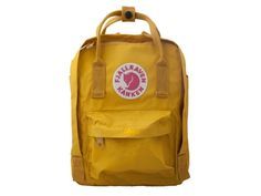 Fjallraven Kanken Mini Backpack Ochre One Size F23561-160. The Mini-version is suitable for small children as well as for full grown adults who are looking for a small backpack. It is perfect for carrying a change of clothes for preschool or food on an outing and as a smart everyday bag for books water bottles fruit and more. The shoulder straps are long and adjustable and fit both small and big backs. They can be fastened with a clasp so that they are not in the way when at their tightest. The Twins Clothes, Fjallraven Kanken Mini, Backpack Fjallraven, Kanken Mini, School Pack, Outdoor Pants, Outdoor Fashion, Lovely Clothes, Small Backpack