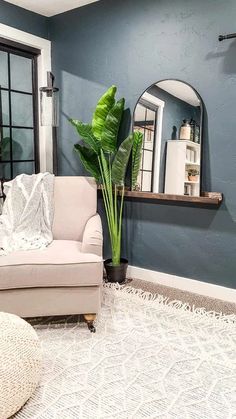 a living room filled with furniture and a mirror