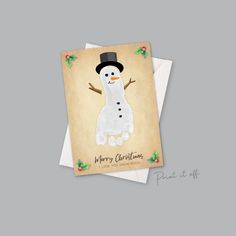 a christmas card with a snowman wearing a top hat and scarf on it's head