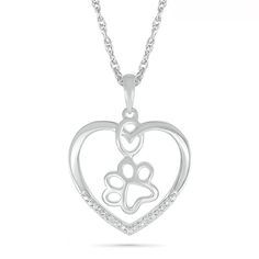 A cute look, this paw print pendant shows what's at the center of your heart. Crafted in sterling silver, this heart-shaped outline showcases an open-worked paw print along the inside. A ribbon of diamond accents and beaded detailing adds a hint of sparkle. Polished to a bright shine, this pendant suspends along an 18.0-inch rope chain that secures with a spring-ring clasp. Elegant Sterling Silver Paw Print Necklace, Elegant Sterling Silver Necklace With Paw Print, Silver Jewelry With Paw Print For Mother's Day, Mother's Day Silver Jewelry With Paw Print, Silver Paw Print Jewelry For Anniversary, Silver Jewelry With Paw Print For Anniversary, Silver Anniversary Jewelry With Paw Print, Paw Print Pendant, Dog Lover Jewelry