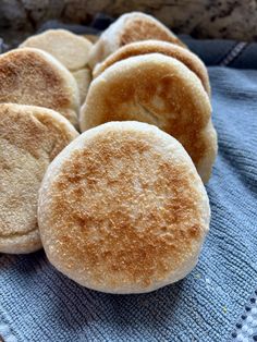 some biscuits are sitting on a blue towel and there is no image here to provide a caption for