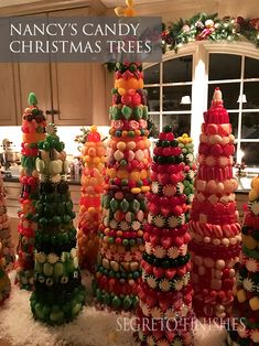 there are many different types of candy trees in the kitchen, each decorated with colorful candies