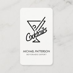 a white business card with the words cocktails on it and a martini glass logo