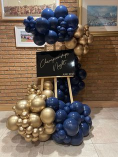 a bunch of balloons that are in front of a chalkboard with the words champagne night written on it