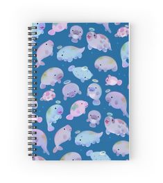 a spiral notebook with pastel elephants on a blue background and stars in the sky