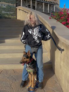 a woman standing on steps with her dog