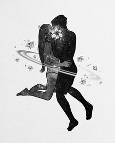 a man and woman are kissing in the air with their arms around each other, surrounded by flowers