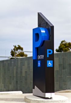 a blue and black sign that says entry to the parking lot