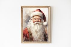 a portrait of santa claus hangs on the wall in front of a white painted background