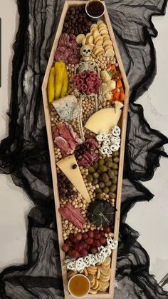 a wooden boat filled with lots of different types of food