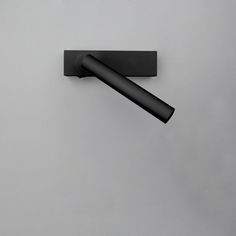 a black object is hanging on the wall