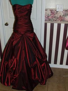 This is a custom made taffeta gown.  It is made to the specifications of each customer as ordered.   It is made of  taffeta, but can be created in another fabric of your choosing..  The bodice is boned for added support and the gown is fully lined.  The back is a corset style and the skirt has pick-ups for fullness. If made in silk taffeta, there will be an additional cost of $350.00. This gown is made of 13 yards of the taffeta and habotai lining. Gown show with very full crinoline.  Crinoline is not included, but  can be added for a price of $85.00. Please allow 6-8 weeks for completion of the gown. If you are interested in a custom made gown in any style, please contact me and send a picture of what you are wanting and I will send you a quote for creating it.    VAT Fees or Any other fe Fitted Taffeta Gown With Sweep Train, Taffeta Gown With Sweep Train And Fitted Bodice, Fitted Bodice Taffeta Floor-length Evening Dress, Fitted Bodice Taffeta Dress For Prom Season, Floor-length Taffeta Evening Dress With Fitted Bodice, Taffeta Prom Ball Gown With Sweetheart Neckline, Taffeta Sweetheart Neckline Prom Ball Gown, Taffeta Ball Gown With Sweetheart Neckline For Prom, Satin Finish Ball Gown With Fitted Bodice For Evening