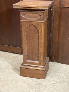 an old wooden grandfather clock sitting on the floor