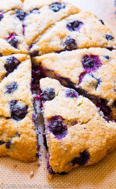 a close up of a cake with blueberries on it