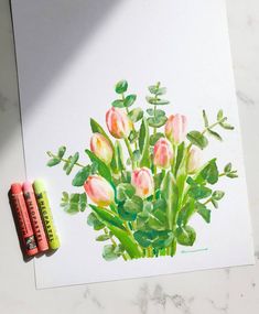 a drawing of pink flowers with green leaves and two crayons next to it