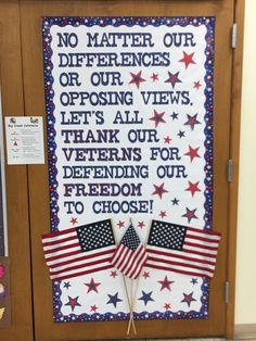 a bulletin board with an american flag and two flags on it's sides, which reads no matter our differences or our views