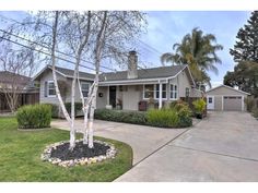 a house with trees in the front yard