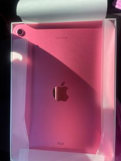 an apple ipad in a pink box