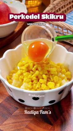 a bowl filled with corn and an egg