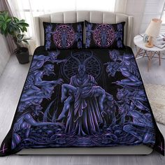 a bed covered in purple and black art with an image of a demon on it