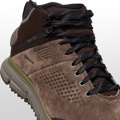 The Danner Trail 2650 GTX Mid Hiking Boot pushes us through the hike while providing premium materials to make ready for the next excursion. The durable and lightweight suede and textile upper defends from abrasion, while the GORE-TEX lining offers waterproof and breathable protection on soaked hiking trails. the reinforced heel counter and TRAILGUARD platform offer maximum support, and an added TPU shank increases torsional stiffness for scrambling up steep, rocky ascents. An OrthoLite footbed Brown Gore-tex Sneakers For Walking, Brown Gore-tex Walking Sneakers, Breathable Leather Boots For Walking, Breathable Leather Walking Boots, Rugged Breathable Leather Boots, Suede Lace-up Work Boots For Hiking, Breathable Leather Lace-up Trail Running Shoes, Brown Gore-tex Lace-up Sneakers, Leather Low-top Hiking Boots For Trail Running