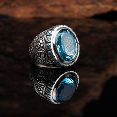 Material: 925 Sterling Silver Stone Type: Blue Topaz Ring Top Dimensions: 20 x 15 mm Average Weight: 27 gr. (depends on your ring size)  Shipping via DHL Express by The Grand Bazaar Istanbul. Delivery Takes 1-3 days to any worldwide location. Shipping is free of charge. FOR MORE HANDMADE JEWELRY VISIT: https://www.etsy.com/shop/GrandBazaarExclusive Sapphire Topaz Ring With Gemstone Accents As Gift, Gift Turquoise Sapphire Ring With Accent Stones, Blue Topaz Gemstones For Gifts, Sapphire Topaz Jewelry With Gemstone Accents, Sapphire Topaz Ring With Gemstone Accents In Sterling Silver, Sapphire Crystal Ring With Gemstone Accents For Gift, Turquoise Topaz Birthstone Jewelry, Elegant Blue Topaz Ring With Stones, Handmade Blue Topaz Fine Jewelry Ring