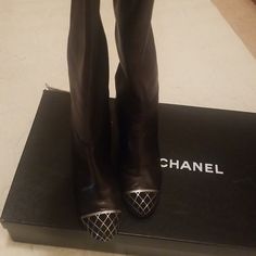 Beautiful Black Soft Leather Chanel Boots With Silver Detail On Toe Cap. Great Condition. Only Worn A Handful Of Times. Some Wear On Heel That I Have Included In Picture. Comes With Original Box And Shoe Dust Bags. 3 Inch Heel. Designer Silver Boots For Formal Occasions, Chanel Boots, 3 Inch Heels, Chanel Shoes, Soft Leather, Black Silver, Bootie Boots, Original Box, Dust Bag