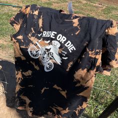 Introducing the "Ride or Die Moto Club Motocross Halloween T-shirt" – Your Ultimate Halloween Moto swag! 🖤 Black Tie dye Bleached Shirt: Elevate your Halloween look with our exclusive black tie dye bleached shirt. This unique design is sure to turn heads. 🏁 Motocross-Inspired Halloween Shirt: For motocross enthusiasts, our shirt features captivating motocross graphics. Get ready to ride with style this Halloween. 👻 Halloween-Themed Moto Fashion: Embrace the spooky season with our Halloween-th Biker Halloween Costume, Motocross Graphics, Bleached Shirt, Black Tie Dye, Ride Or Die, Halloween Looks, Halloween Fashion, And So The Adventure Begins, Halloween T Shirt