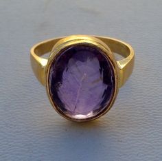 Vintage 18k solid gold ring from Rajasthan India. Beautiful design seted amethyst gemstone. Nice handmade molded ring made of 18k solid yellow gold, Good for your jewellery collection.Usa ring size - 8 (we can adjust the size)width of top - 1.5 cm Weight - 6.7 gramsMaterial - 18k solid gold. Handmade Amethyst Ring In Yellow Gold, Gold Amethyst Ring With Bezel Setting, Gold Amethyst Ring With Hallmark, Solid Gold Ring, Unusual Jewelry, 18k Gold Ring, Funky Jewelry, Rajasthan India, Pretty Rings