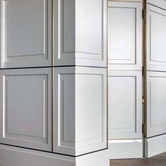 two white cabinets with gold trim on the doors and one is painted in light gray