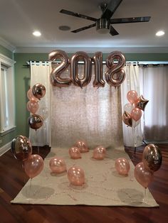 balloons and streamers are arranged in the shape of numbers for a new year celebration