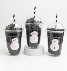 three cups with straws in the shape of snowmen