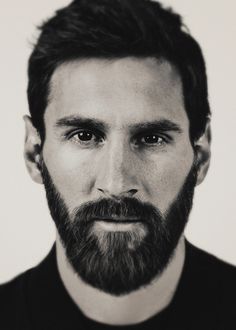 a black and white photo of a man with a beard